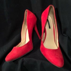 Red suede pumps